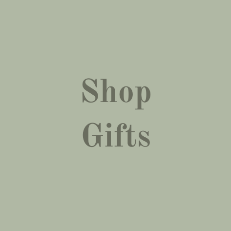 "Shop Gifts" in the middle of a green pebble shape.